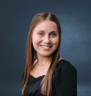 Taylor Smith, Recruiting Director at True Vision Enterprises, smiling in professional attire
